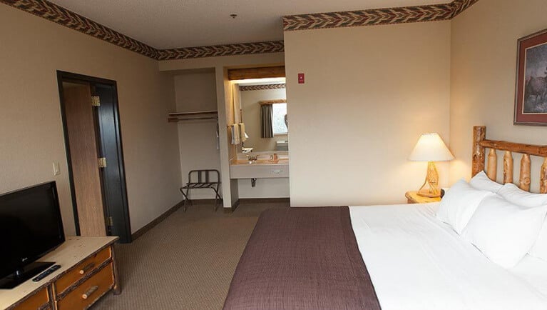 Private bedroom with king size bed in the Majestic Bear Suite